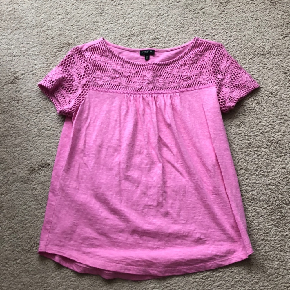 Pink top with lace sleeves.